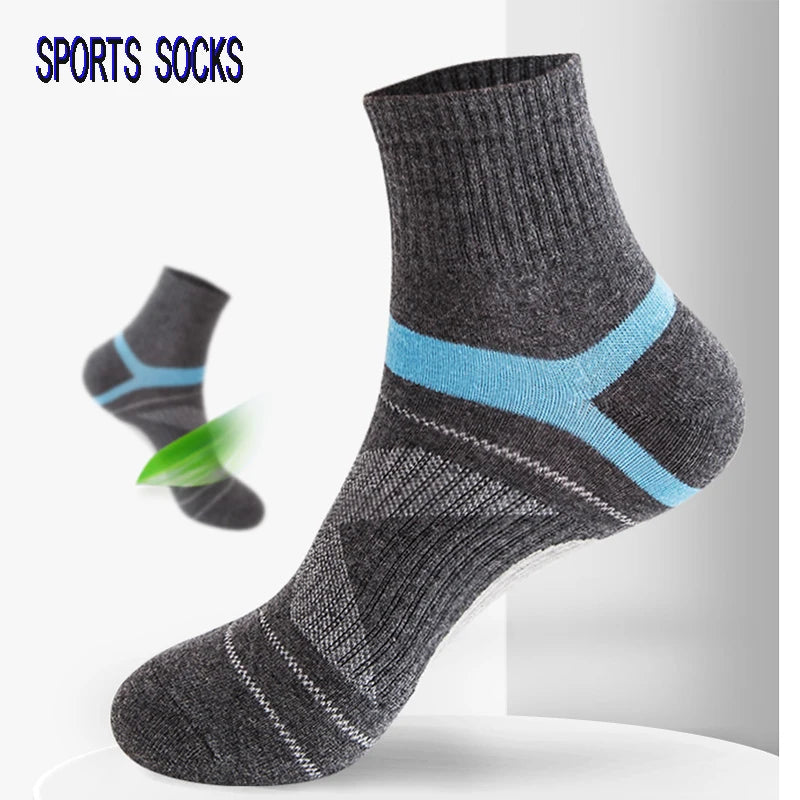 Gray sports socks with blue stripes on a white background