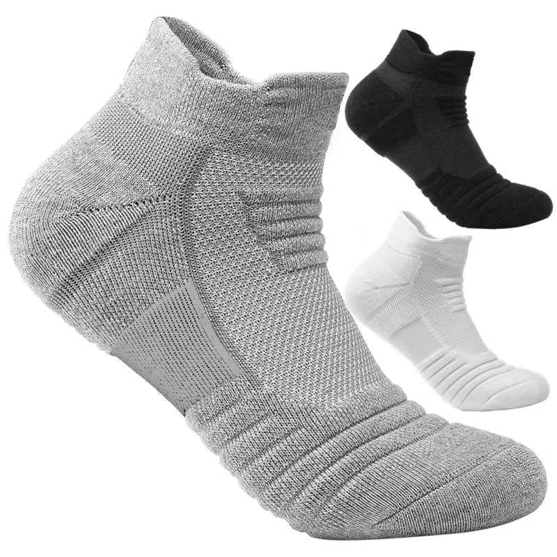 Gray, black, and white ankle socks on a white background
