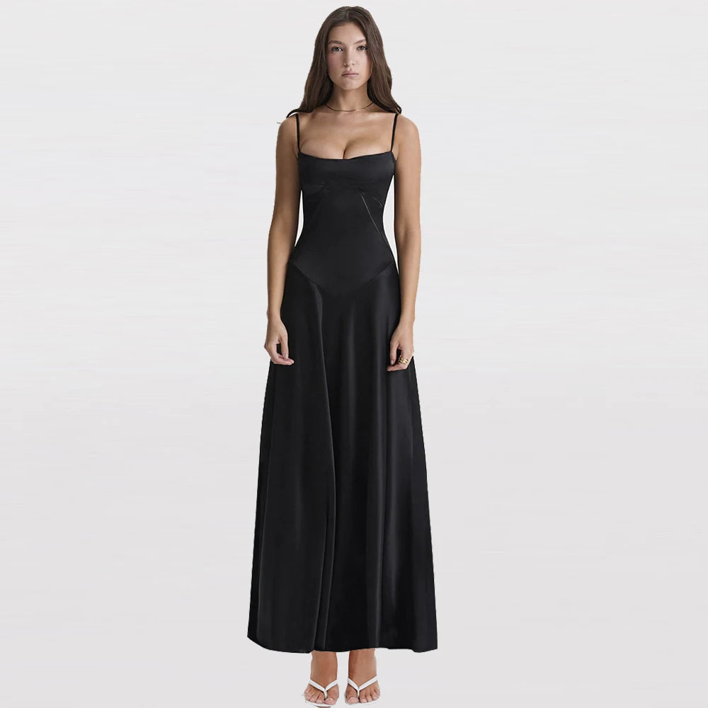 Woman wearing a black evening gown on a light gray background
