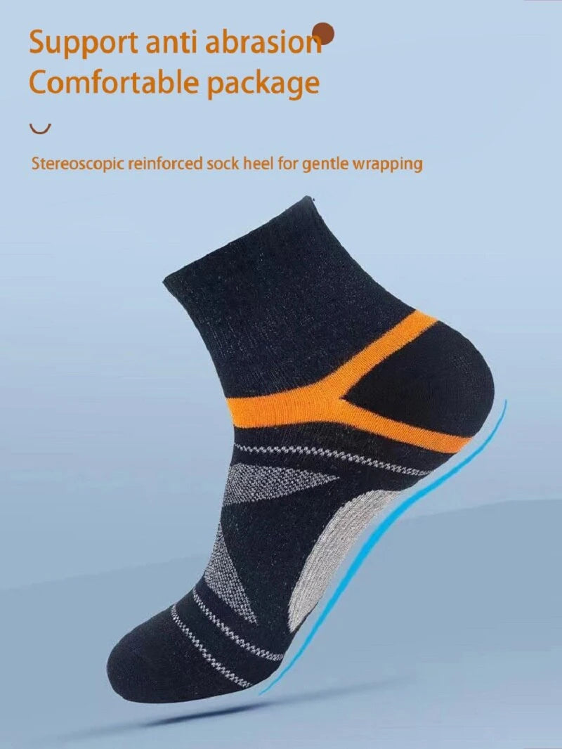 Black sock with orange stripe on a light blue background