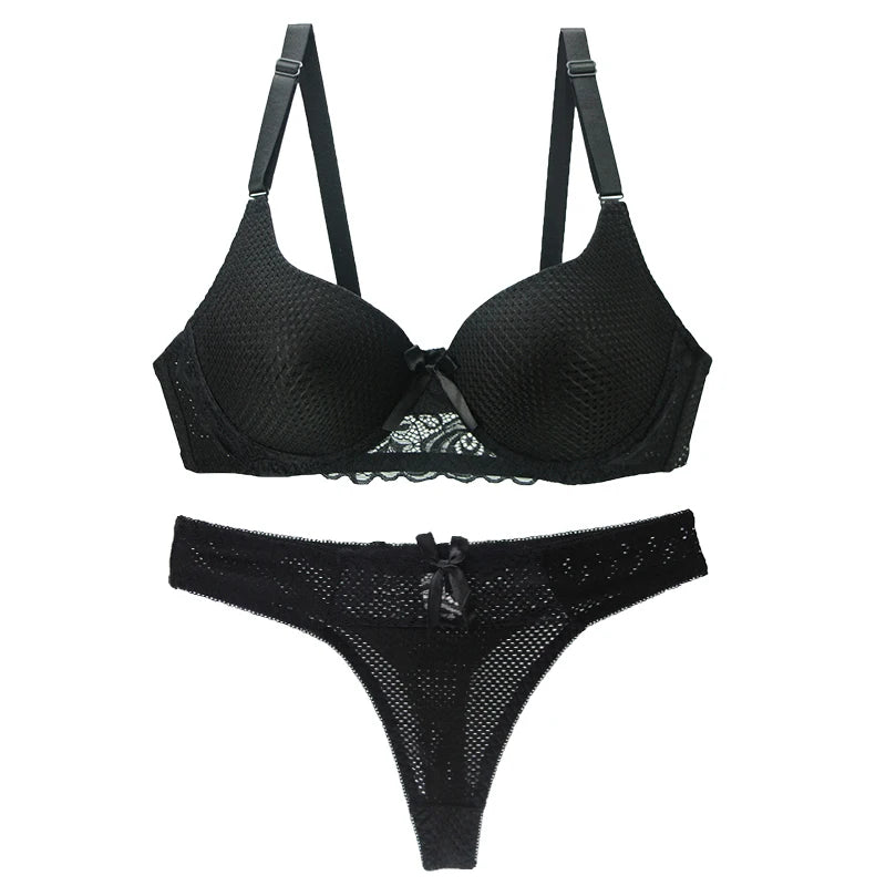 Black lingerie set with mesh details on a white background