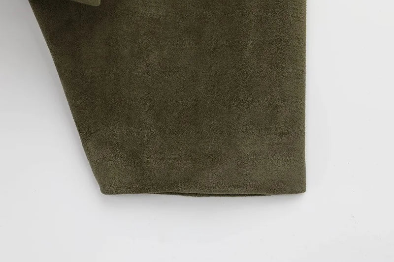 Close-up of a brown suede fabric on a white background
