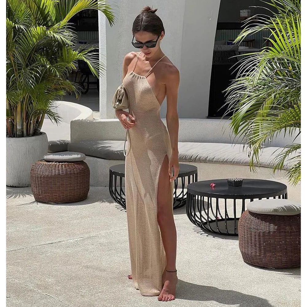 Woman wearing a beige knitted beach cover up maxi dress by the pool