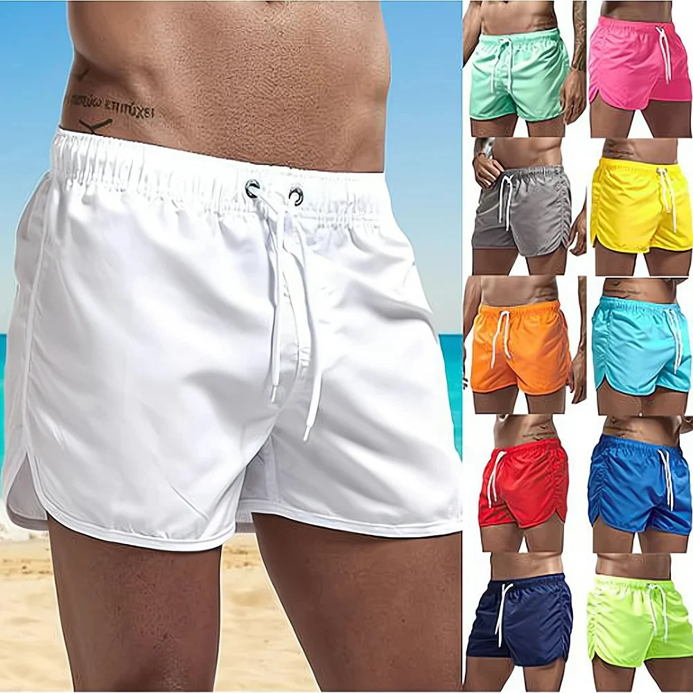 Men’s quick-dry swim trunks in white with drawstring on a beach background
