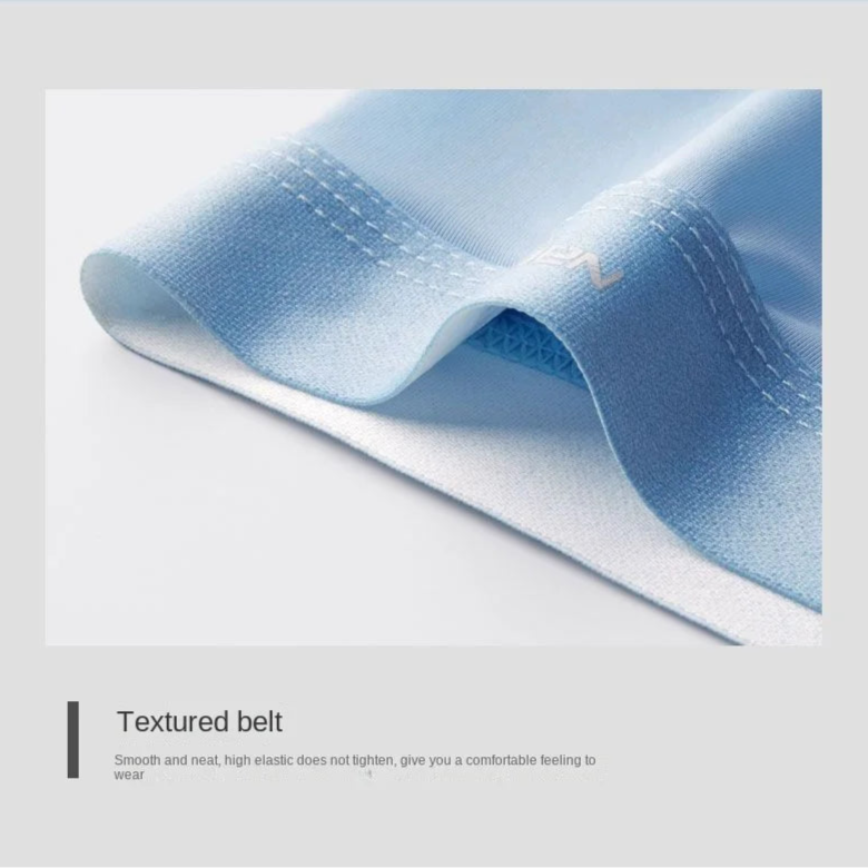 Close-up of a textured blue belt with stitching details on a light gray background.