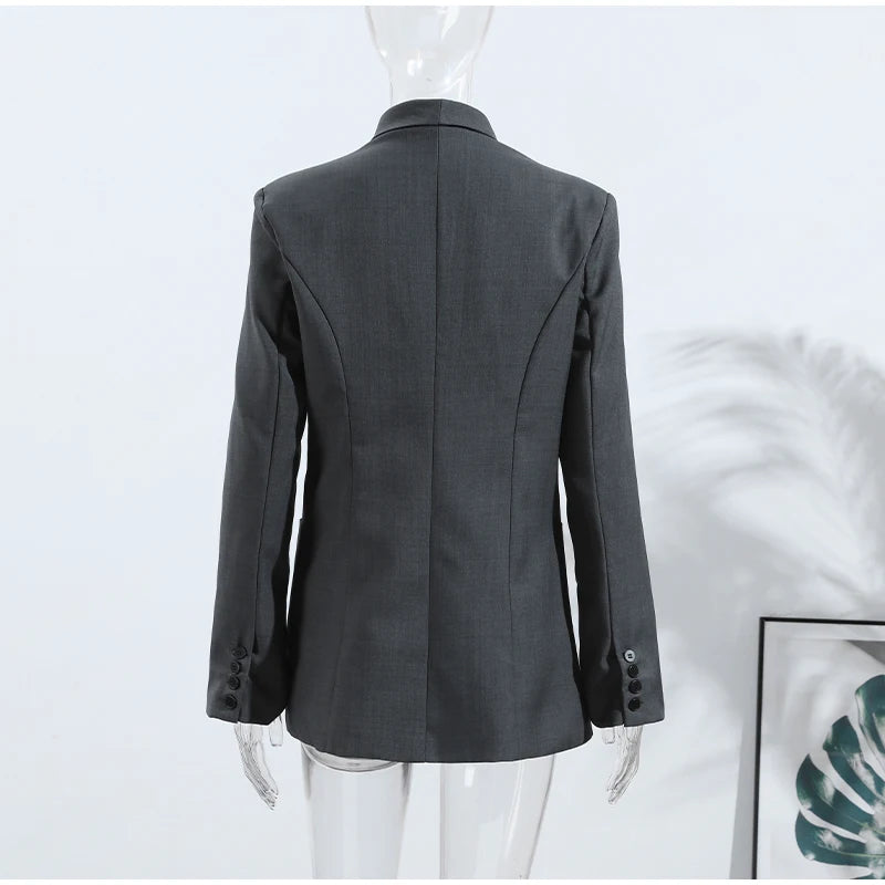 Gray blazer on a mannequin against a white background