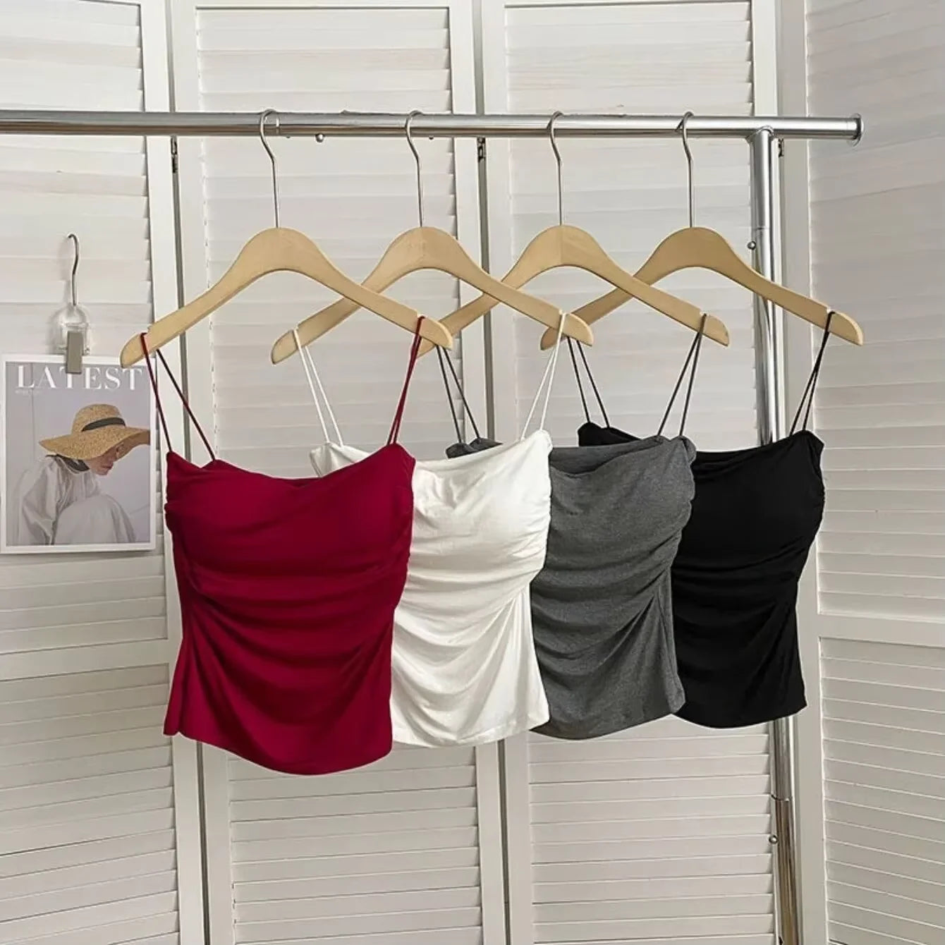 Ruched sleeveless cami tops in red, white, grey and black on hangers