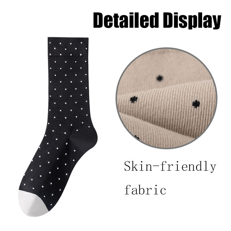 Black sock with white polka dots and close-up of fabric texture on a white background