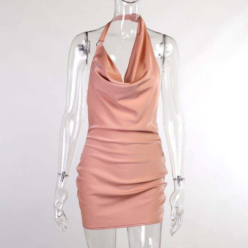 Pink halter neck dress on a mannequin against a white background