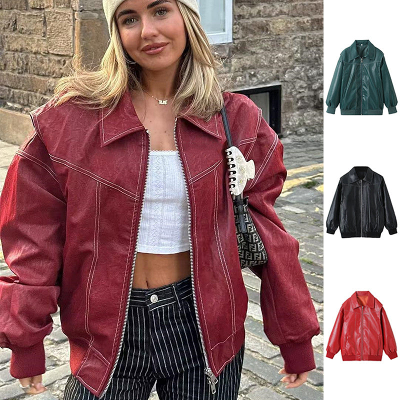 Woman wearing a red jacket with a brick wall background